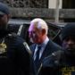 Longtime Donald Trump adviser Roger Stone arrives for his arraignment on charges of lying to Congress
