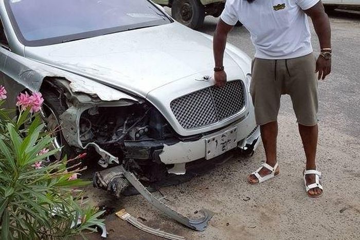Timaya with his bashed Bentley