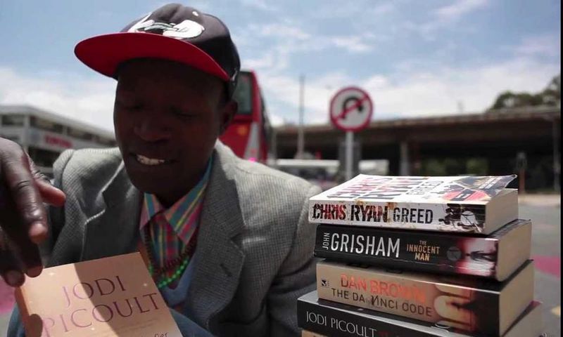 The "Pavement Bookworm" has attracted attention near and far because of his unconventional methods of making money while homeless.