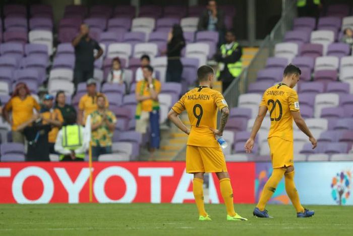 Down after going under: Australia's defence of their Asian title grew tougher after an opening loss to Jordan