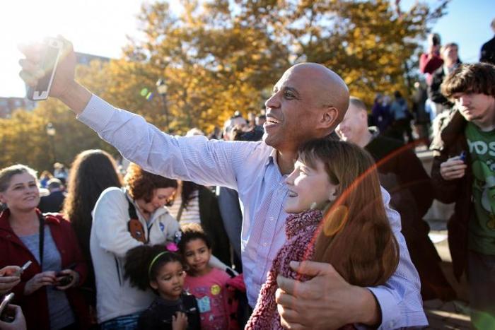 Senator Cory Booker, seen her taking a selfie at a rally, has announced he is running for president, joining a crowded Democratic field