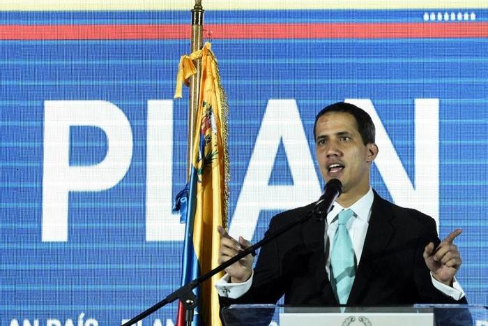 Venezuelan opposition leader and self-proclaimed acting president Juan Guaido presents a plan for his government in Caracas
