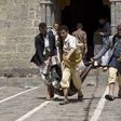 Yemenis carry a body of a man killed in a bomb attack in a mosque in Sanaa, Yemen, Friday, March 20, 2015.