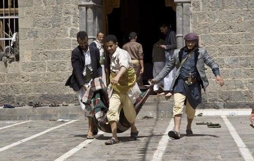 Yemenis carry a body of a man killed in a bomb attack in a mosque in Sanaa, Yemen, Friday, March 20, 2015.