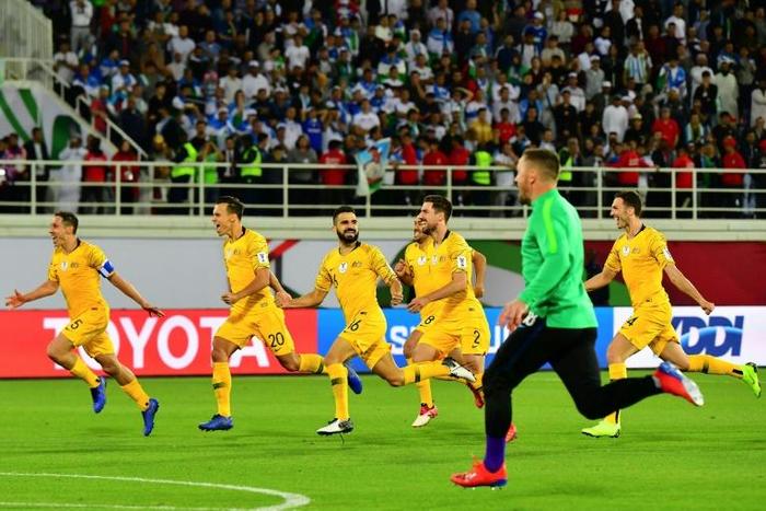 Australia's players celebrate their shoot out victory over Uzbekistan