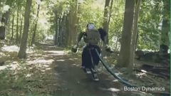 The Atlas humanoid robot taking a walk in the forest