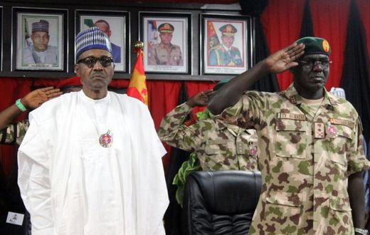 Nigerian president Muhammadu Buhari (L) ordered an end to the newspaper office siege, his spokesman said