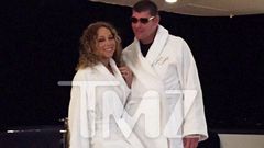 Mariah Carey and James Packer wearing matching white robe in Itlay