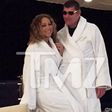 Mariah Carey and James Packer wearing matching white robe in Itlay