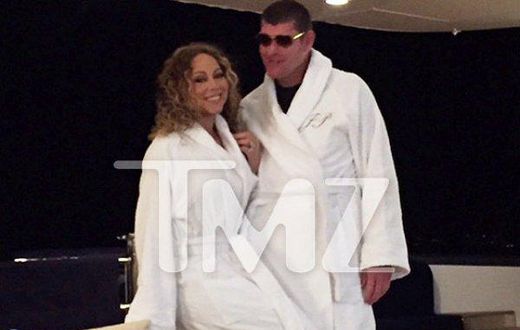 Mariah Carey and James Packer wearing matching white robe in Itlay
