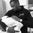 John Dumelo with his baby