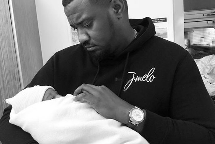 John Dumelo with his baby