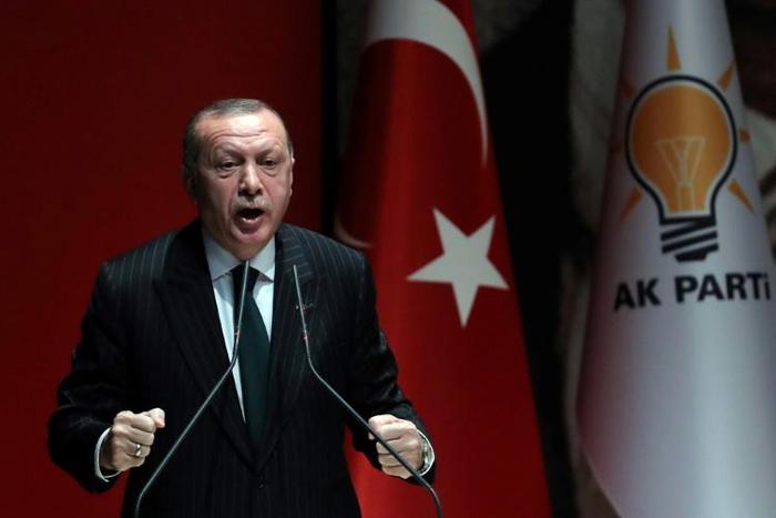 President of Turkey and ruling Justice and Development (AK) Party chairman Recep Tayyip Erdogan makes a speech during a meeting at party headquarters, in Ankara on December 6, 2018