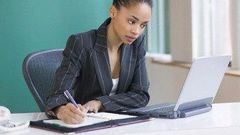 A woman using computer for her task. (fabwoman)