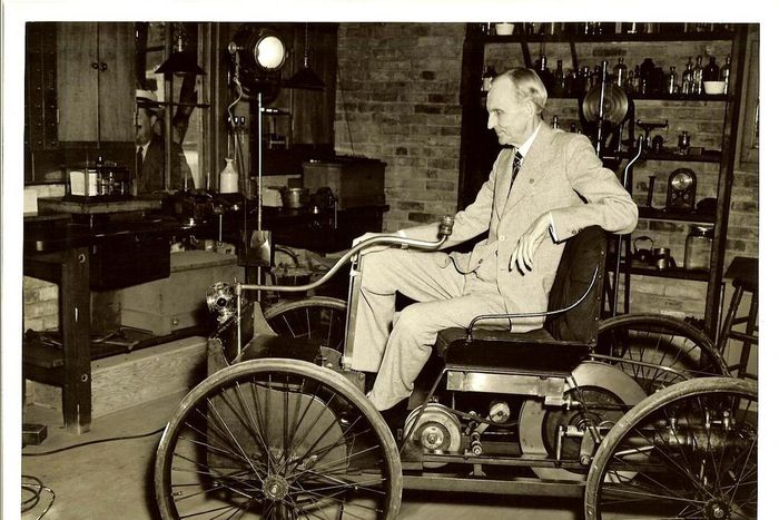 Henry Ford, Founder of the Ford Motor Company, with one of the earliest versions of the modern day car