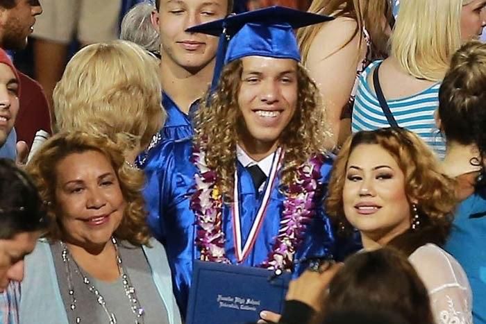 Mildred, Joseph Baena and a friend at the graduation ceremony