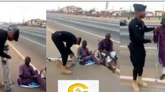 Compassionate Ghanaian police officer buys clutches for disabled beggar (Video)