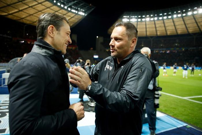 Hertha Berlin head coach Pal Dardai (R) hopes to get one over Bayern Munich boss Niko Kovac (L) when the two clubs meet in the German Cup