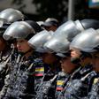 Members of the Bolivarian National Police stand guard in Caracas, during a protest against the government of President Nicolas Maduro on January 30, 2019