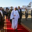 Sudan's President Omar al-Bashir (C) is received upon his return from Qatar at Khartoum international airport