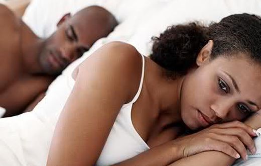 Unhappy woman in bed