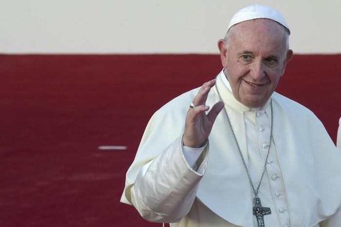 Pope Francis waves good-bye as he prepares to board the plane for the Vatican at Tocumen Airport after participating in World Youth Day, in Panama City, on January 27, 2019