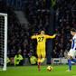 Mohamed Salah (R) celebrates after scoring from the decisive penalty in Liverpool's 1-0 win away to Brighton on Saturday
