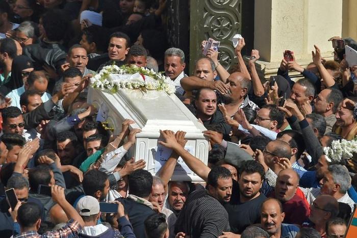 In this file photo taken on November 3, 2018, Coptic Christians carry the coffin of a victim killed in a jihadist attack a day earlier in Egypt's Minya province