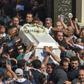 In this file photo taken on November 3, 2018, Coptic Christians carry the coffin of a victim killed in a jihadist attack a day earlier in Egypt's Minya province