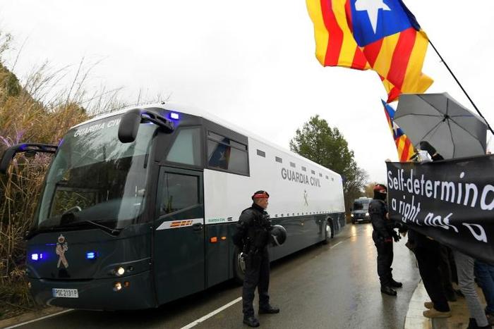 Catalan separatist leaders were transferred by bus to Madrid for their trial this month