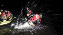 Syrian migrants are pushing away Nigerians and other African refugees  who try to board their boat to the Greek island of Kos.