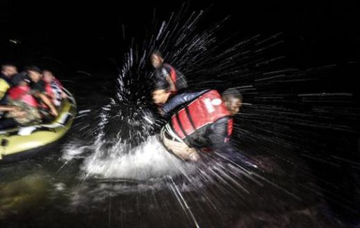 Syrian migrants are pushing away Nigerians and other African refugees  who try to board their boat to the Greek island of Kos.