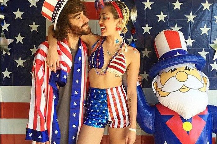 Miley Cyrus and her assistant, Cheyne Thomas celebrating America's Independence
