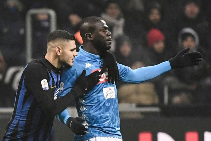 Inter Milan captain Mauro Icardi (L) comforts Napoli's Senegalese defender Kalidou Koulibaly amid racist chanting at the San Siro