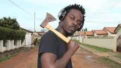 Kwaw Kese with an axe