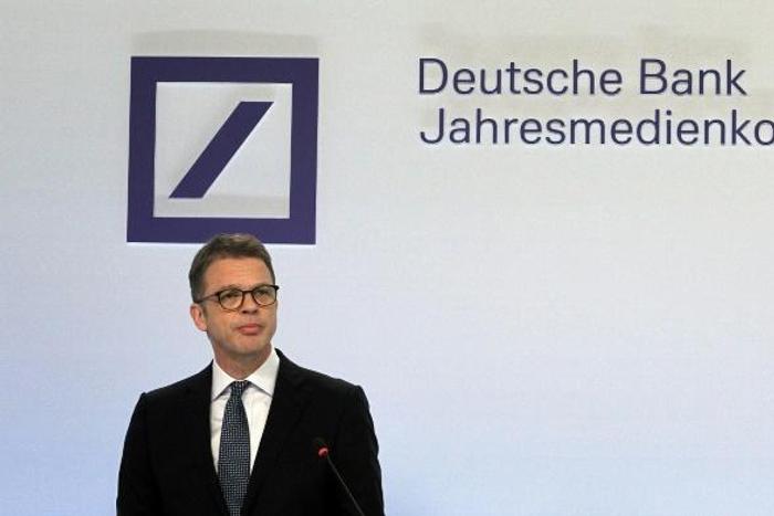 The CEO of Germany's biggest lender Deutsche Bank Christian Sewing addresses the media during the company's annual financial statement which showed it in profit for the first time in four years