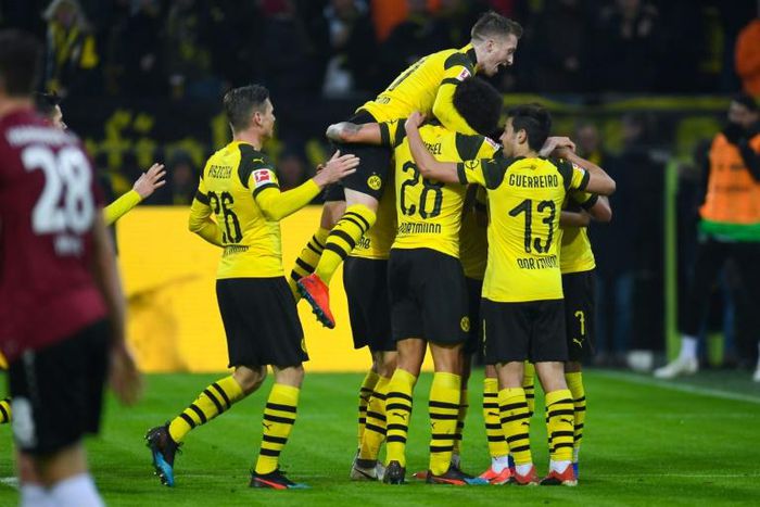 Marco Reus leads the celebrations as Borussia Dortmund rout Hanover 96 to go nine points clear of Bayern Munich in the Bundesliga