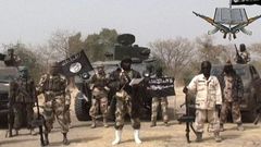 The sect leader Abubakar Shekau, flanked by his subordinates.