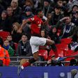Manchester United forward Marcus Rashford celebrates his goal against Tottenham at Wembley