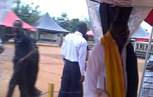 King George Arthur laid to rest while standing & holding football