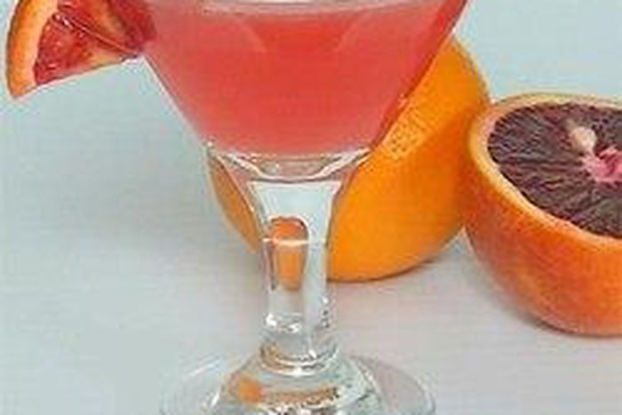 a glass of martini mixed with tangerine