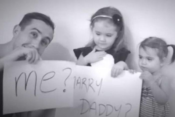 Screenshots from a Facebook video where Scott Dunga Worgan proposes to his girlfriend, Caitlin Miller, via their two daughters.