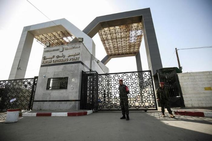 Palestinian security forces loyal to Hamas stand at the Rafah crossing point between Egypt and the southern Gaza Strip on January 24, 2019 in Rafah