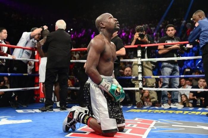 Floyd Mayweather kneels after the final round against Andre Berto (not pictured) in their WBA/WBC welterweight title bout at MGM Grand Garden Arena. Mayweather won via unanimous decision September 13, 2015.