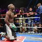Floyd Mayweather kneels after the final round against Andre Berto (not pictured) in their WBA/WBC welterweight title bout at MGM Grand Garden Arena. Mayweather won via unanimous decision September 13, 2015.