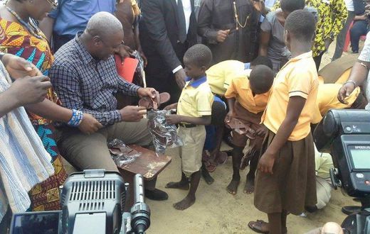 President Mahama distributing sandals to students