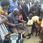 President Mahama distributing sandals to students