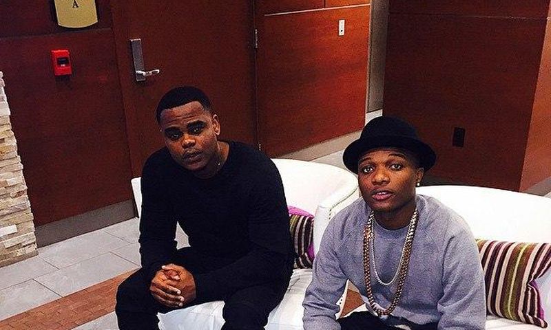 Wizkid with a friend in Houston spotting his Balenciaga race runner footwear which costs $695 a piece