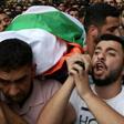 Palestinians carry the body of Aisha Rabi who died after a stone-throwing attack, during her funeral in the West Bank village of Bidiya on October 13, 2018