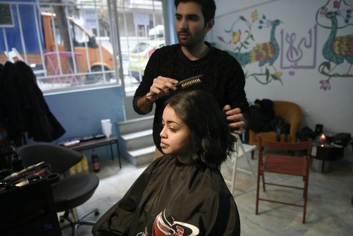 Manassif Raza opened his own hair salon in Athens after escaping poverty in Pakistan and spending two years in Greece doing whatever work he could get